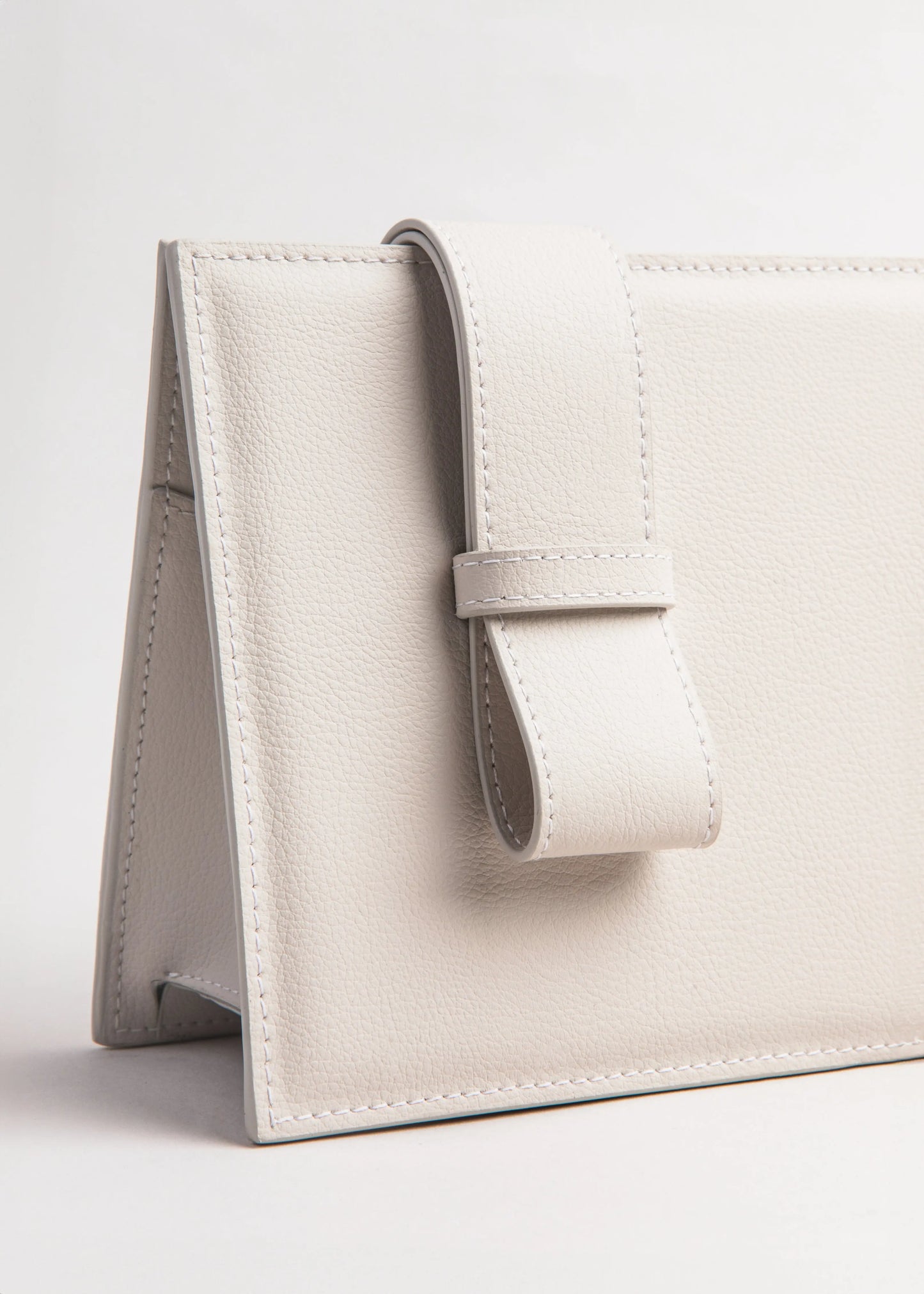 Qosmic Elara Moonstone cream handbag - strap detail lateral view