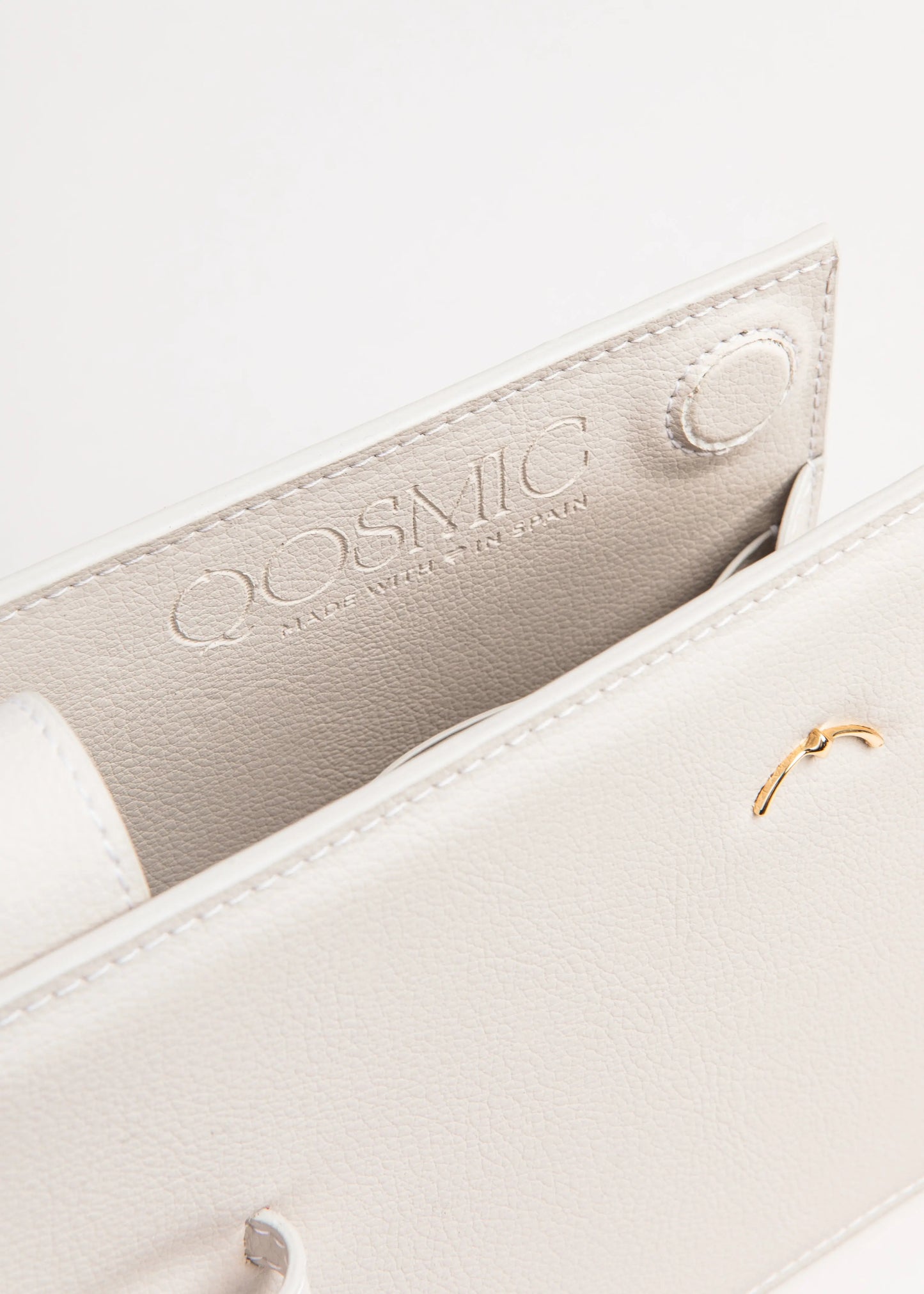Qosmic Elara Moonstone - cream handbag - button and brand